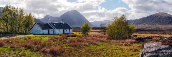 A panoramic view of the Blackrock Cottage with Buchaille Etive Mor in the background, near Glencoe, Scotland.