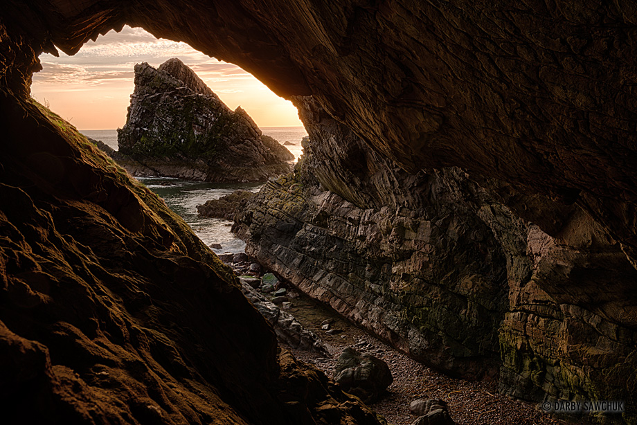 Bow Fiddle Rock viewed from a nearby cave off the north Coast of Aberdeenshire, Scotland.