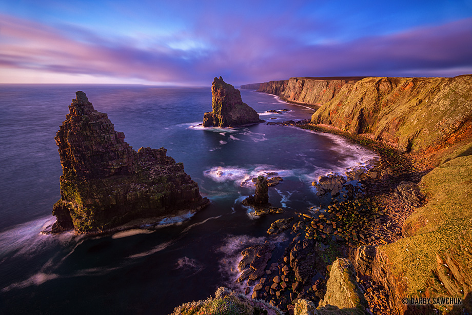 Dawn light illuminates the Duncansby Stacks in Caithness in the north of Scotland.