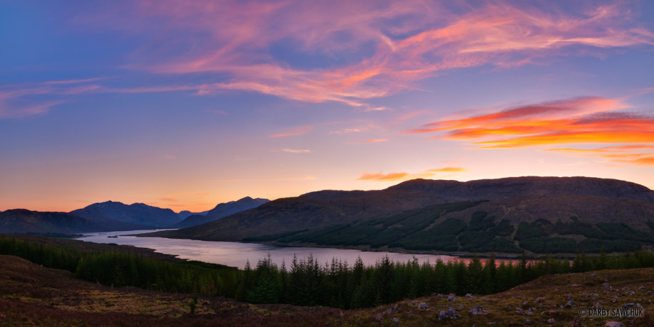 A panoramic view of Loch Loyne at sunset in the Highlands of Scotland.
