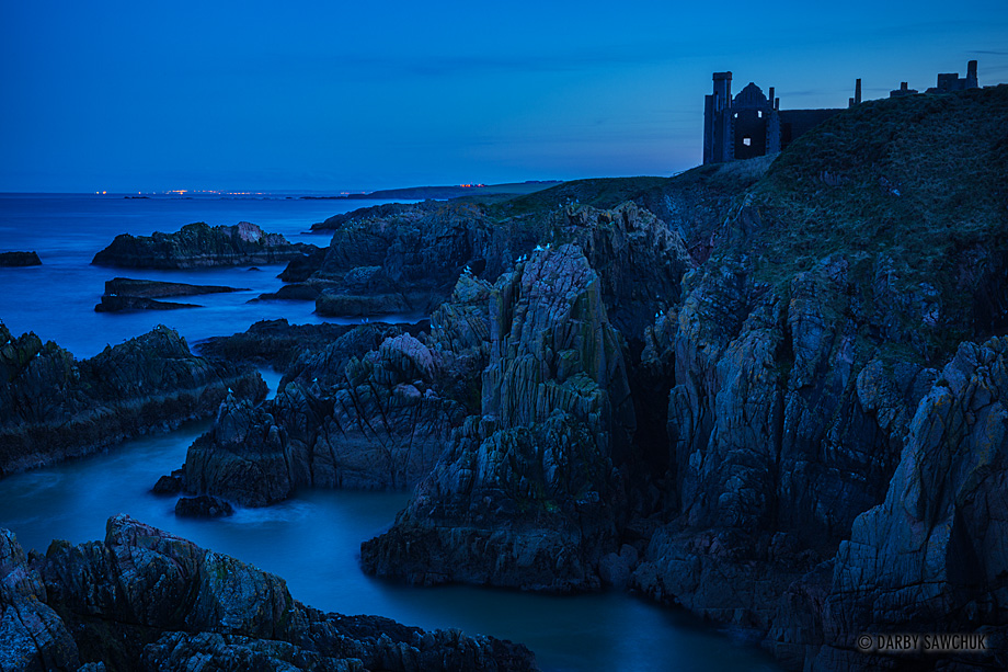 The ruins of Slains Castle atop cliffs looking out to the North Sea in Aberdeenshire, Scotland.