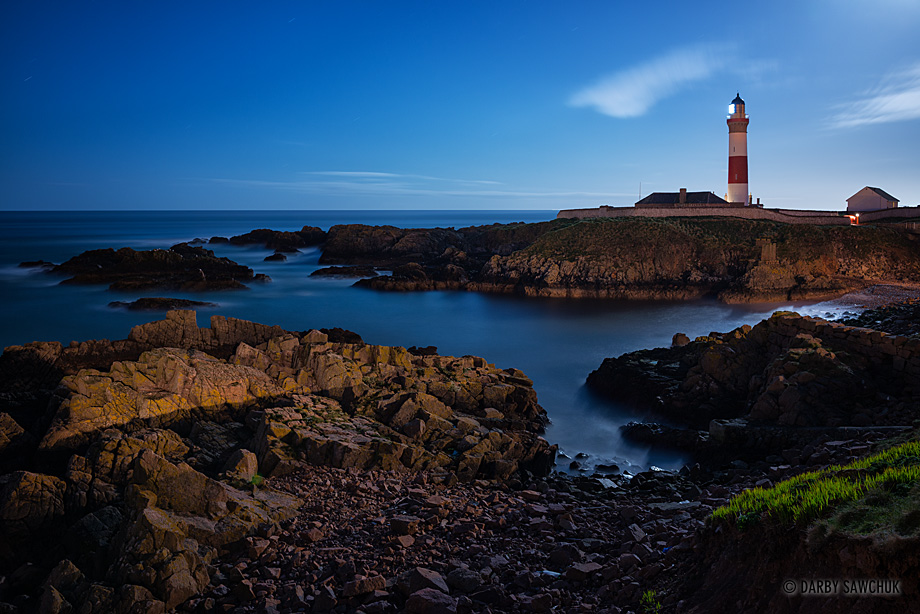 Boddam lighthouse on the east coast of Scotland at night.