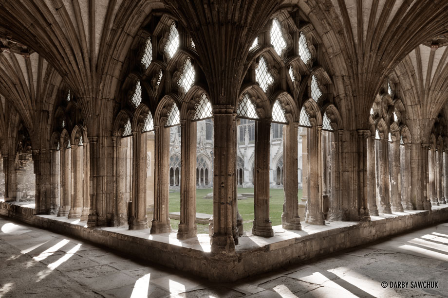 The gothic arches and tracery of the cloister at Canterbury Cathedral.