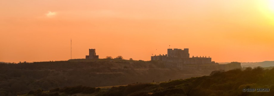 A panoramic view of Dover Castle at sunset.