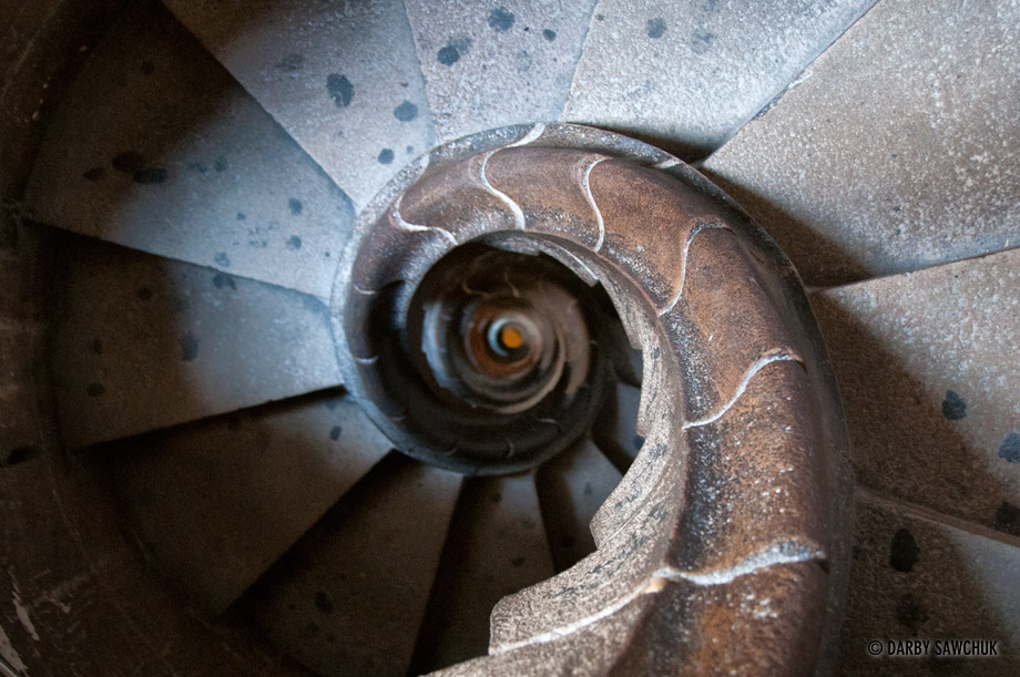 A spiral staircase descends one of the towers in the Sagrada Familia Cathedral.