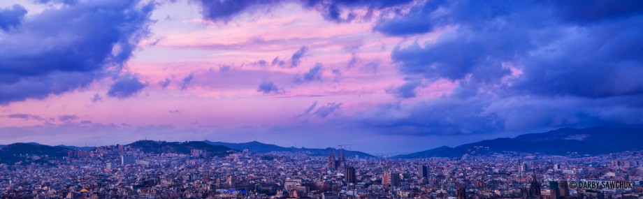 A panoramic view of Barcelona at dawn.
