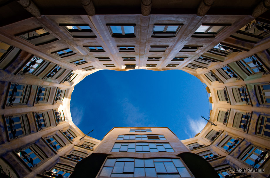 The view upwards from one of the courtyards in La Perdrera designed by Antoni Gaudi.