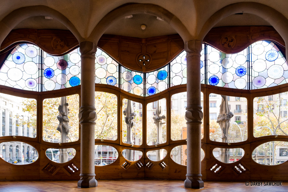 Curving windows look out from Casa Batllo designed by Antoni Gaudi.