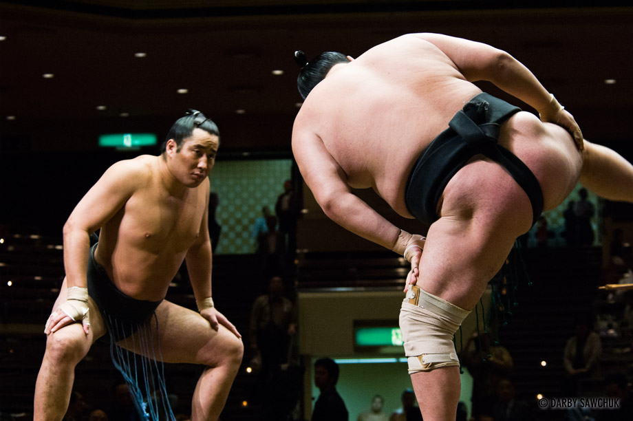 Sumo wrestlers stomp to ward off evil spirits at the Ryogoku stadium in Tokyo, Japan.