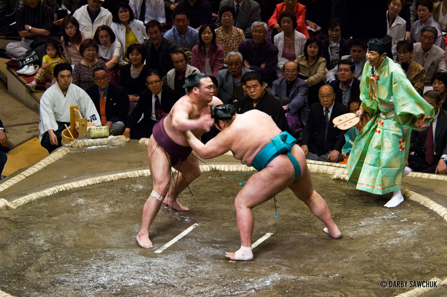 Sumo wrestlers fight at the Ryogoku stadium in Tokyo, Japan.