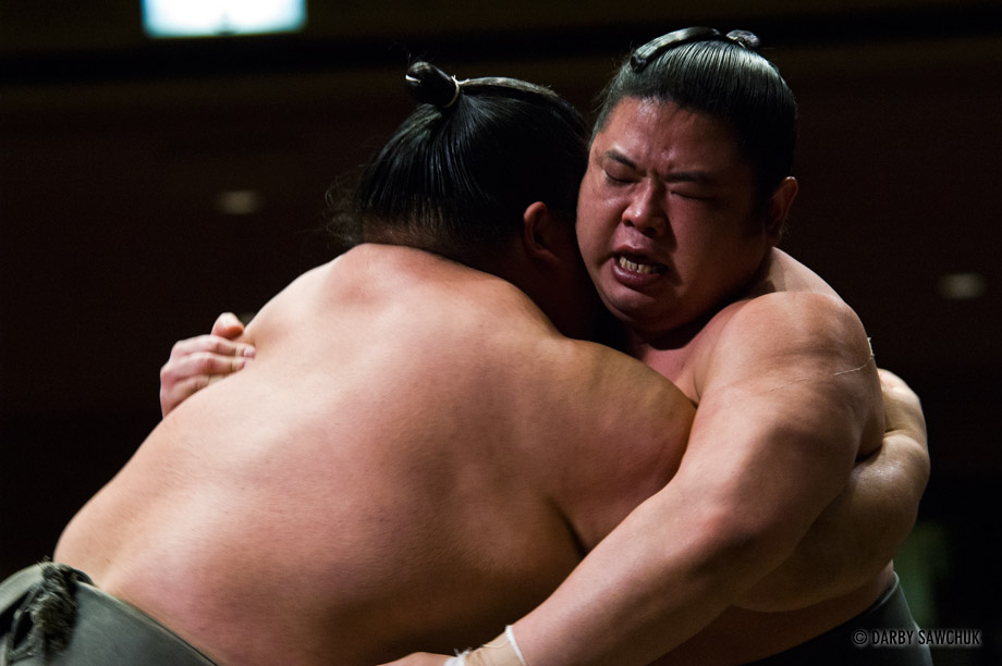Sumo wrestlers grapple at the Ryogoku stadium in Tokyo, Japan.