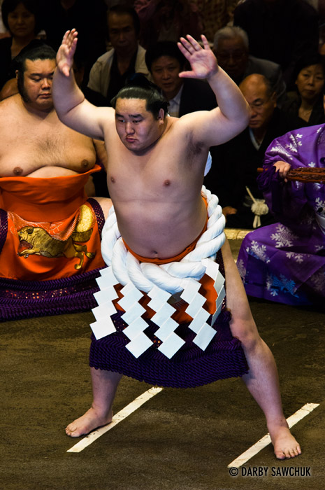 A yokozuna, the highest rank of sumo wrestling wears the symbol of his rank, a rope (tsuna), around his waist at the Ryogoku stadium in Tokyo, Japan.