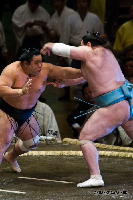 SSumo wrestlers battle at the Ryogoku stadium in Tokyo, Japan.