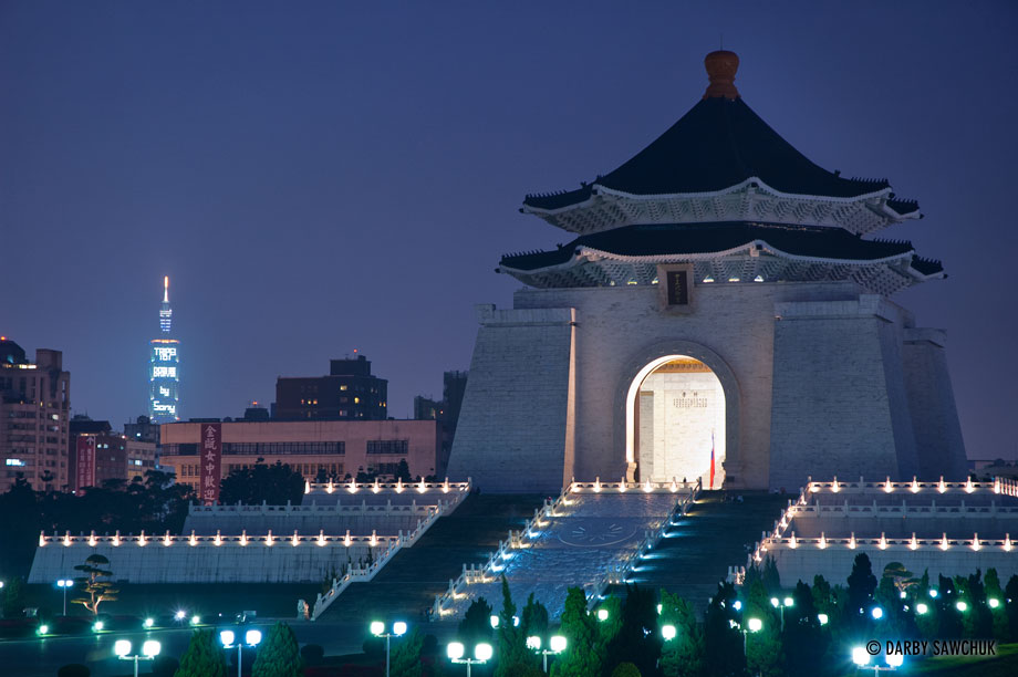 Evening at the Chiang Kai-Shek Memorial Hall with Taipei 101 visible in the distance in Taipei, Taiwan.