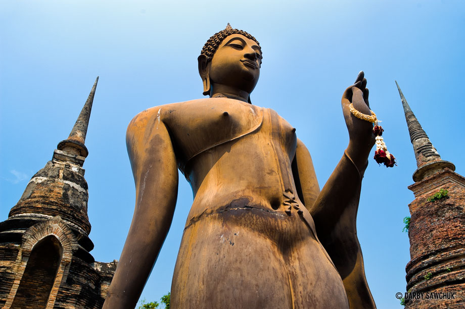 A Buddha statue at Wat Sa Sri in the Sukhothai Historic Park in Thailand.