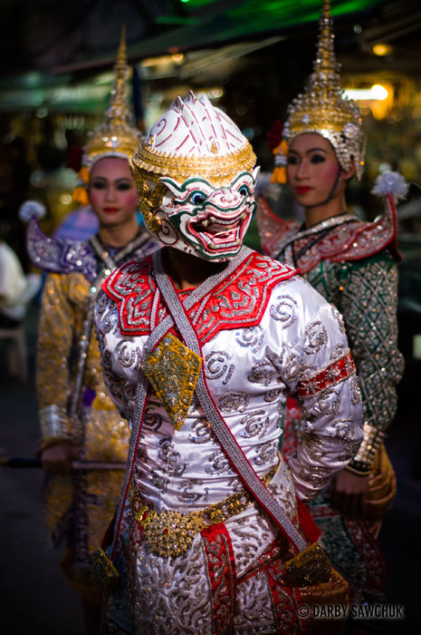 Costumed Thai dancers performing a Khon dance on Khao San Road in Bangkok, Thailand.