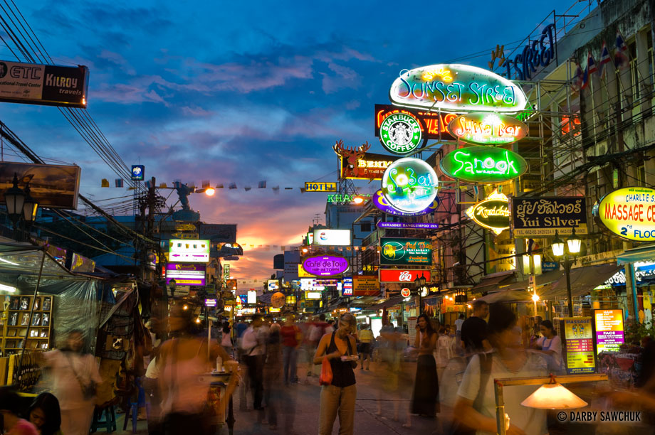 Khao San Road at dusk, a popular backpacker neighborhood in Bangkok, Thailand.