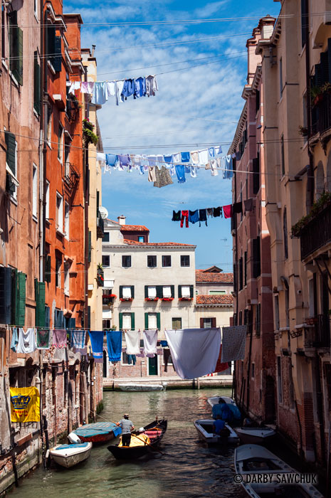 Laundry is strung between buildings over a canal in the Jewish Ghetto of Venice.