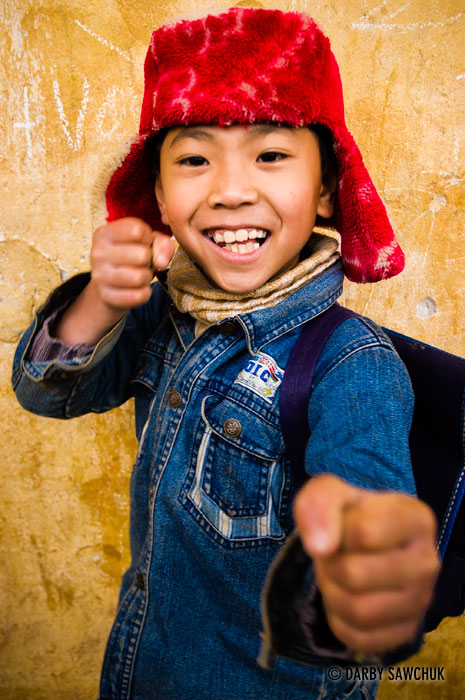 A boy poses for a photo at his school in the hills near Sapa, Vietnam.
