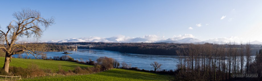 A panoramic view of the Menai Suspension Bridge linking Anglesey and the mainland of Wales.